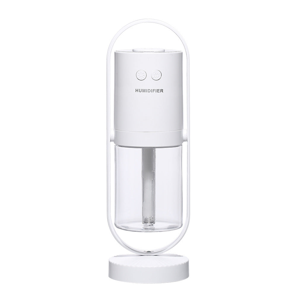 White unit, plain white background — White portable USB humidifier with clear water tank, front view
