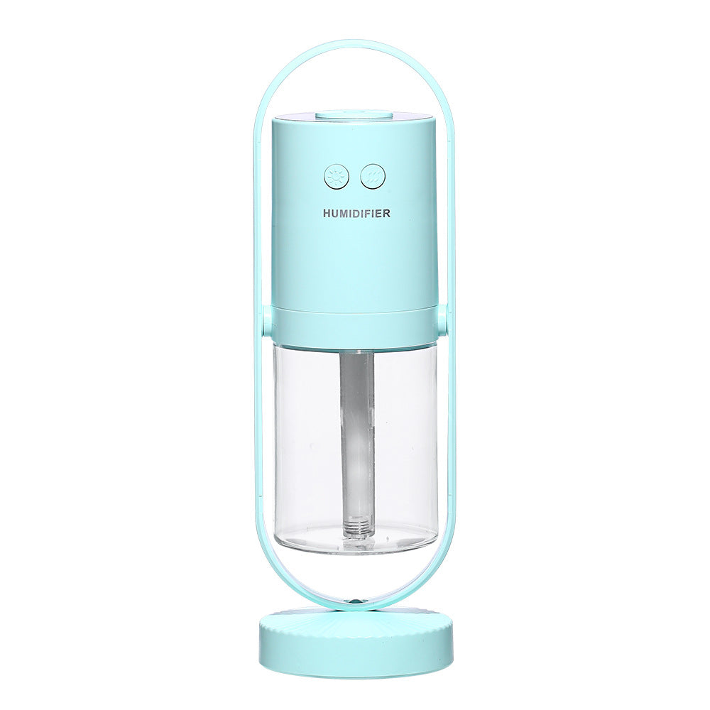Teal unit, plain white background — Teal portable USB humidifier with clear water tank, front view