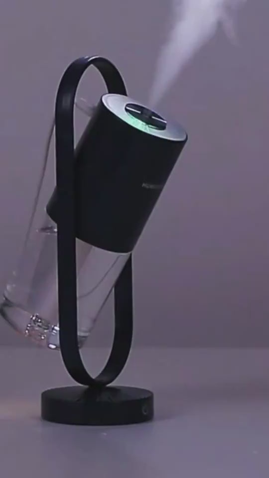 Dark unit on stand, side angle (video thumbnail) — Portable USB humidifier on stand producing mist, demo video